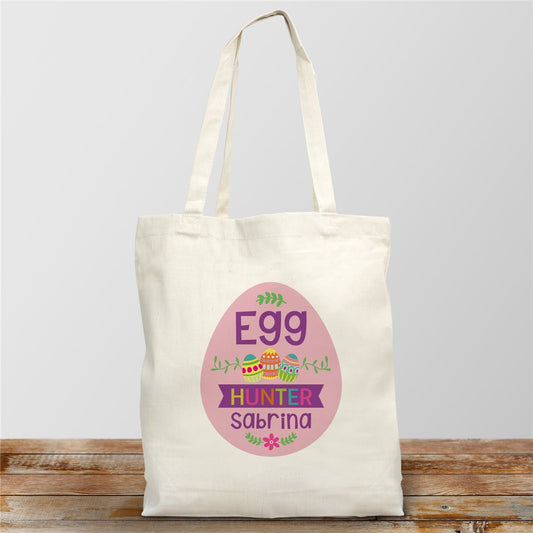 White cotton Easter tote bag with colorful festive design and personalized child’s name printed on the front.