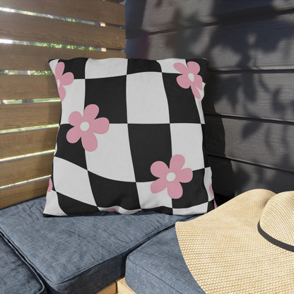 UV- and water-resistant outdoor pillow featuring checkered pattern with pink flowers