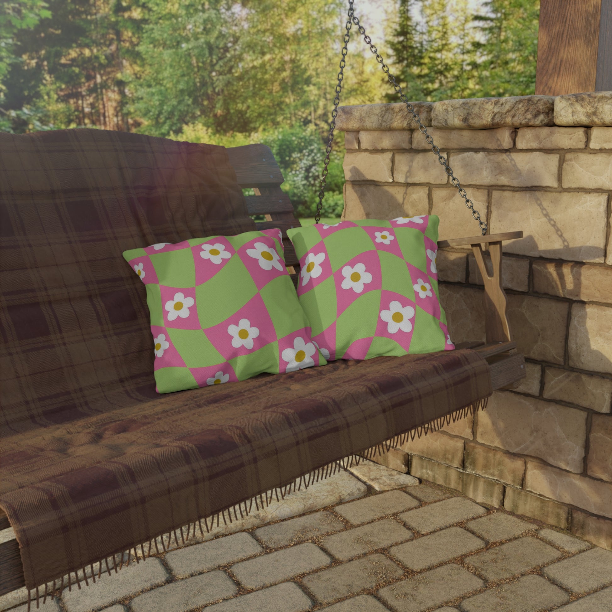 Boho-inspired patio pillow showcasing playful flower pattern and lush color