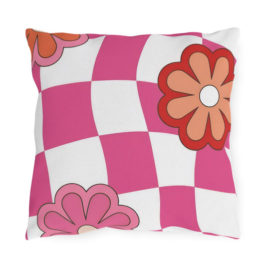 Colorful floral outdoor pillow with pink, red, white, orange, and purple accents