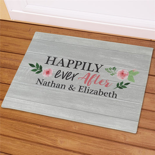 Personalized Happily Ever After doormat with couple’s names printed in black script on a white fleece mat with bound edges