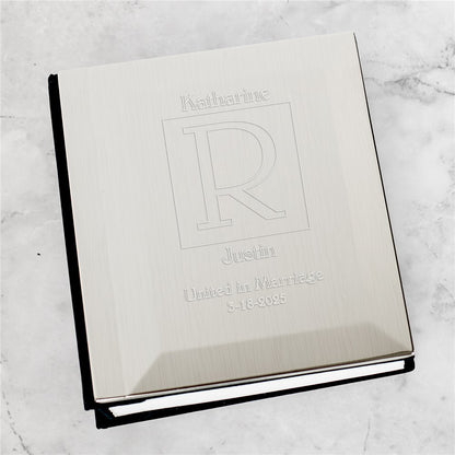 Engraved silver wedding photo album with personalized names and date