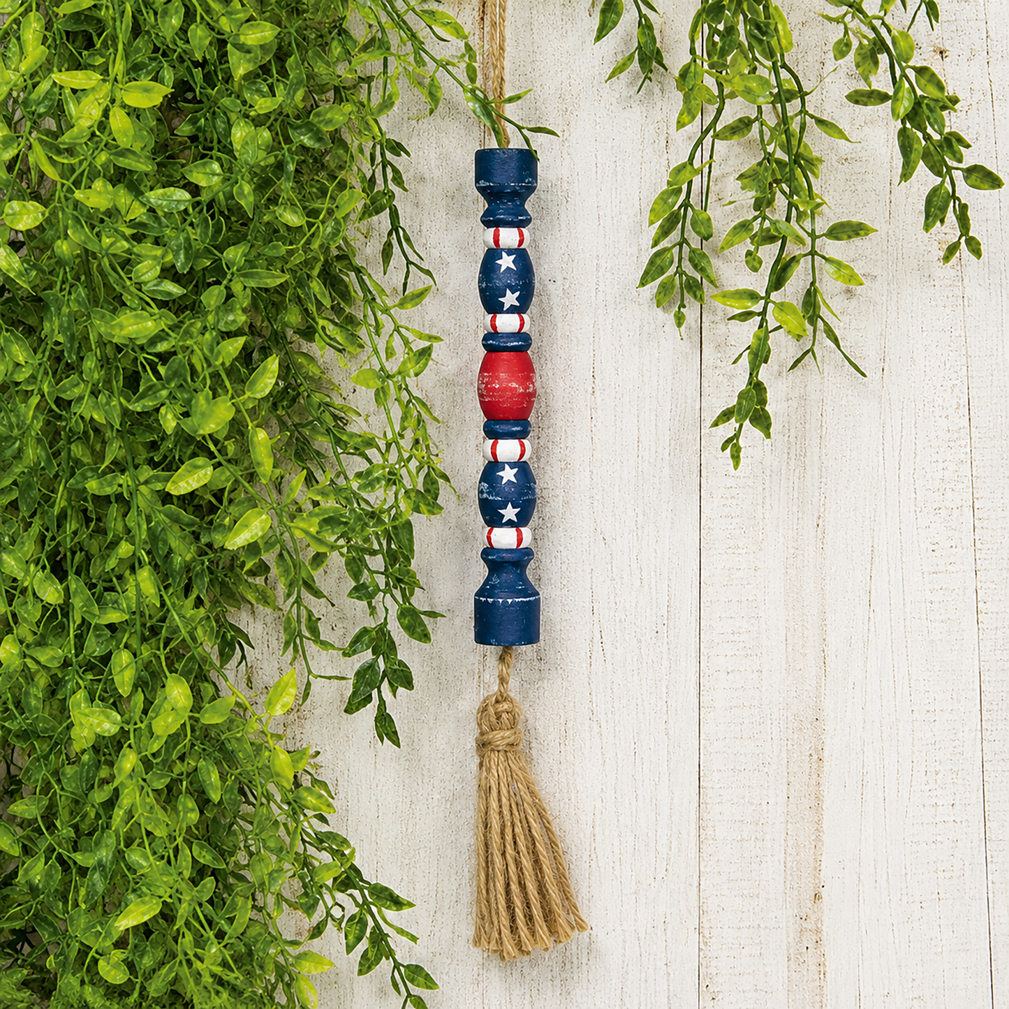 Distressed patriotic firecracker ornament for farmhouse Americana decor, Fourth of July displays, rustic summer decorating, hanging shelf accents, and primitive patriotic styling
