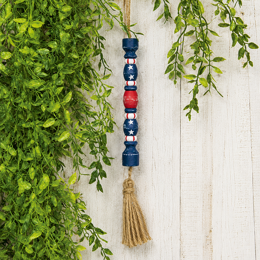 Distressed patriotic firecracker ornament for farmhouse Americana decor, Fourth of July displays, rustic summer decorating, hanging shelf accents, and primitive patriotic styling