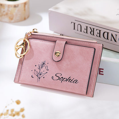 A styled shot of the pink vegan leather wallet displayed against a stack of books, showcasing its sleek and elegant design, perfect for everyday use and a thoughtful gift.