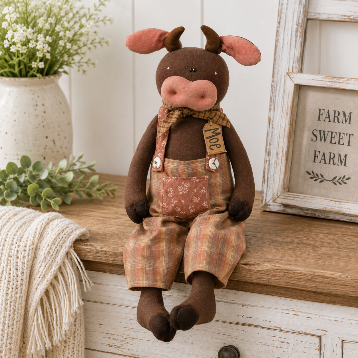 Moe the Bull primitive plush shelf sitter with brown canvas body, plaid overalls, dangling legs, rustic country farmhouse home decor