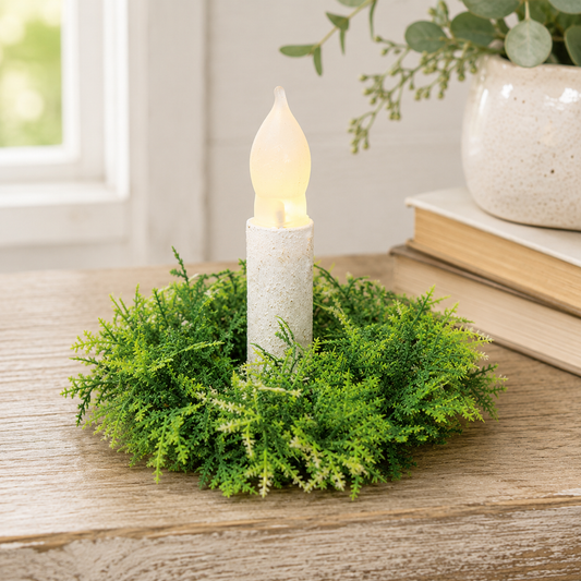 Forest Moss green candle ring with dense leafy branches in layered light and dark green tones surrounding the open center.