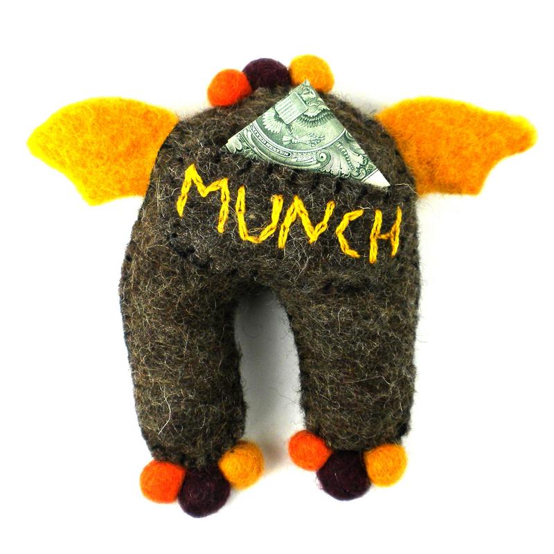 Handmade felt monster Tooth Fairy pillow with a back pocket for lost teeth and surprises.