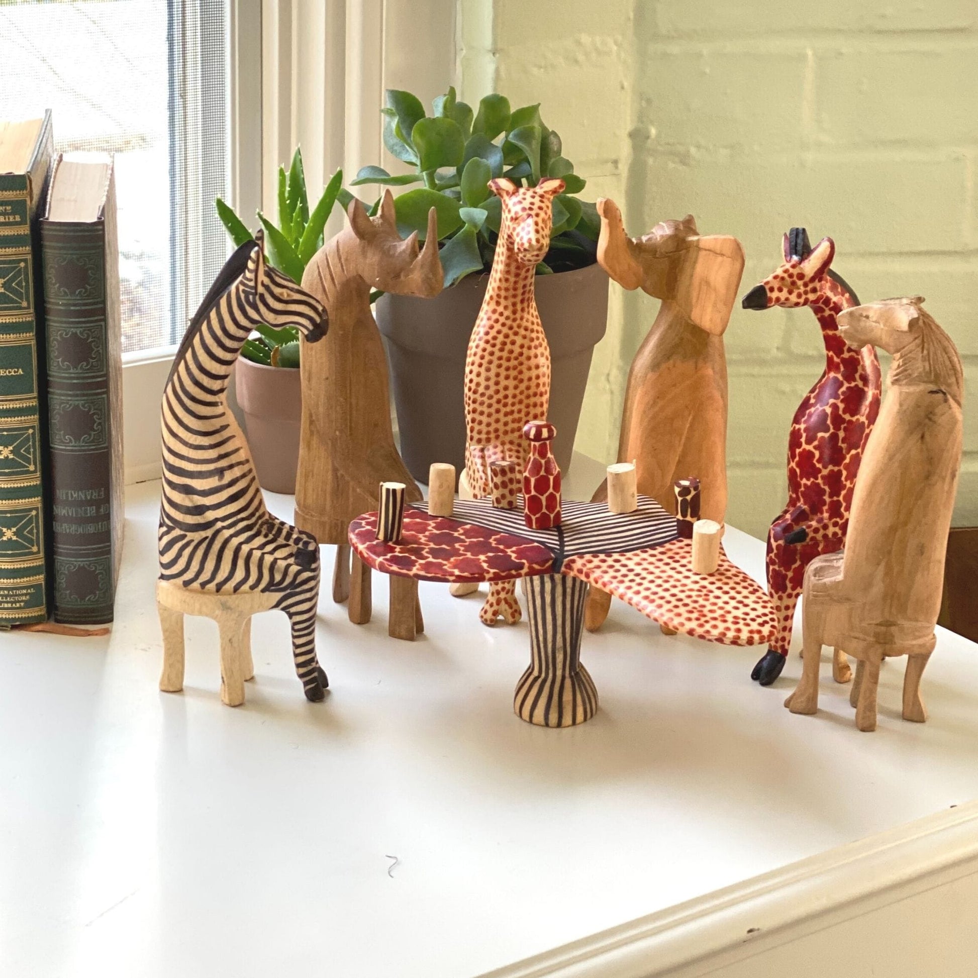 One-of-a-kind wooden animal figurine set, showcasing traditional hand-carved artistry and ethical craftsmanship.