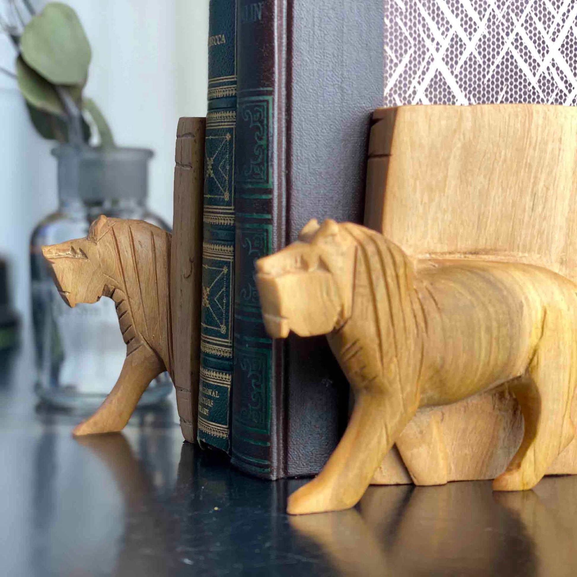 Natural wood grain detail on carved lion bookend