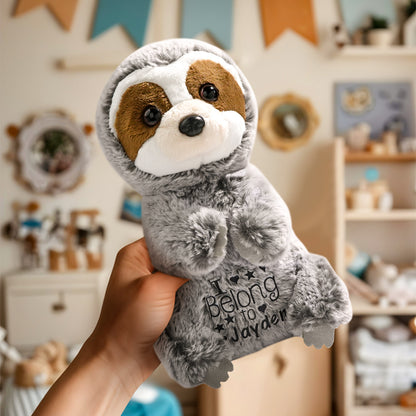 A close-up view of the personalized sloth plush toy being held in a hand, showcasing its soft, cuddly design and embroidered baby’s name, perfect for playtime or nursery decor.