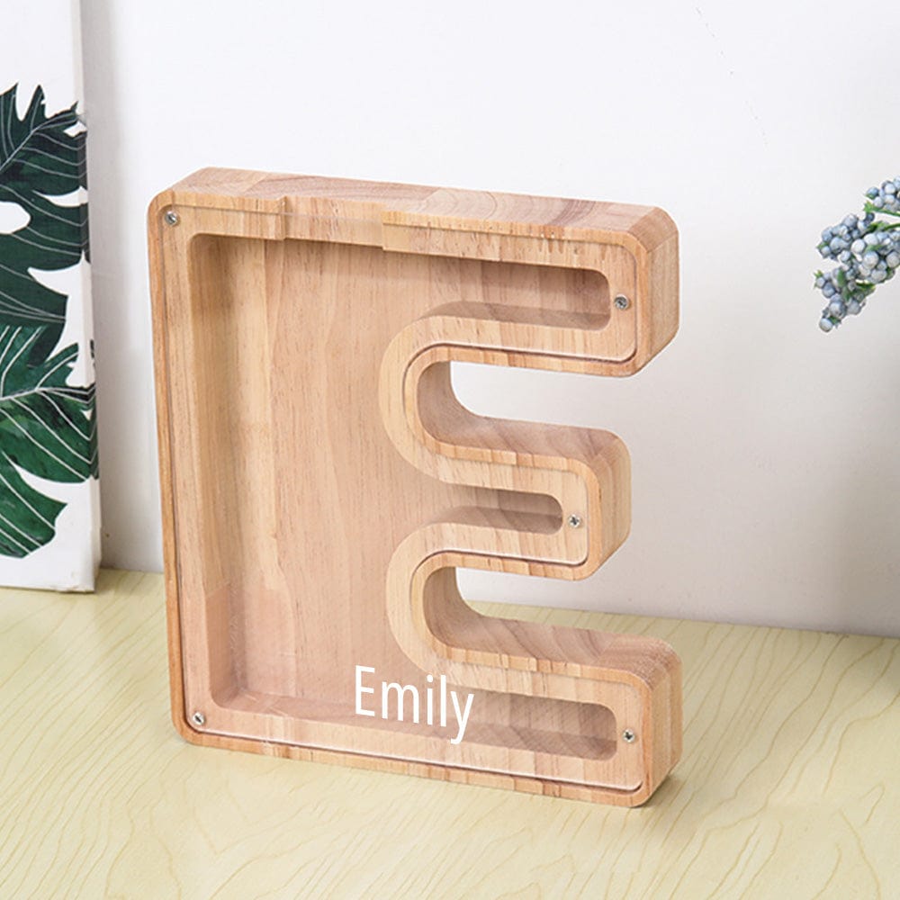 A wooden "E" piggy bank in burlywood with a transparent acrylic face, ideal for saving money in a fun, interactive way.