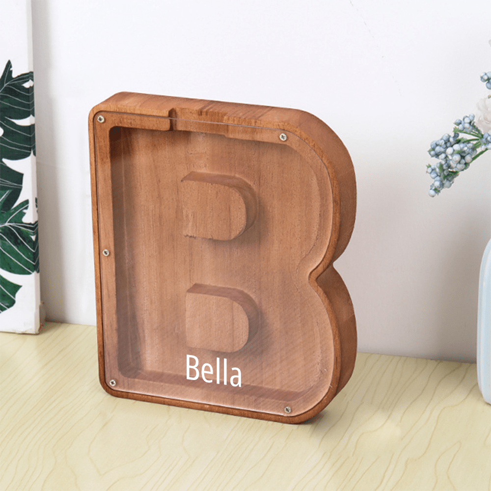 A custom "B" letter piggy bank in brown with an acrylic panel, ideal for helping kids develop saving habits.