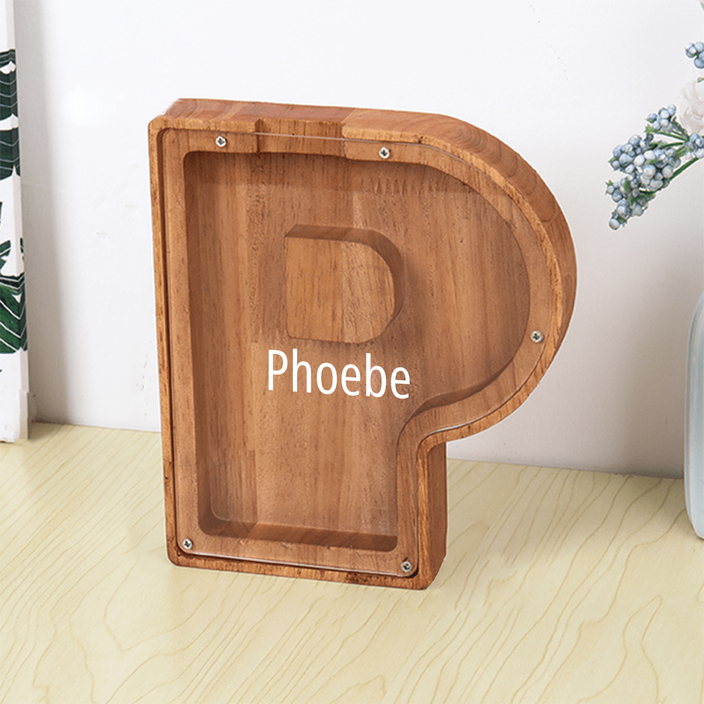 A personalized "P" piggy bank in brown with a sleek acrylic panel for tracking savings, making it an engaging way for kids to learn money management.