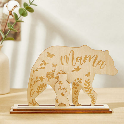 A wooden table decoration featuring a mama bear and one cub, each customizable with the customer's choice of text, showing the arrangement of the two pieces.