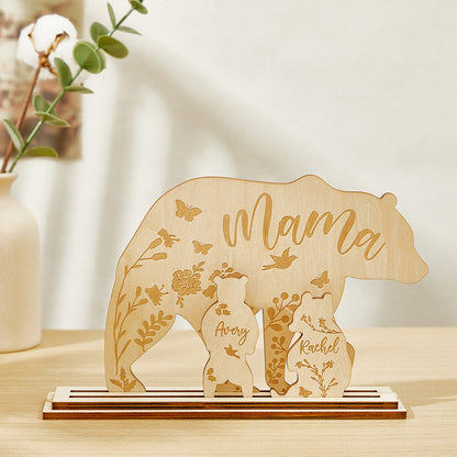 A wooden table decoration featuring a mama bear and two cubs, each customizable with the customer's choice of text, showing the arrangement of the three pieces.