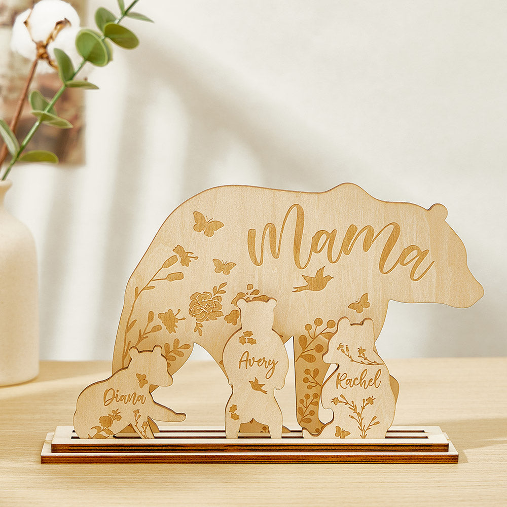 A wooden table decoration featuring a mama bear and three cubs, each customizable with the customer's choice of text, showing the arrangement of the four pieces.