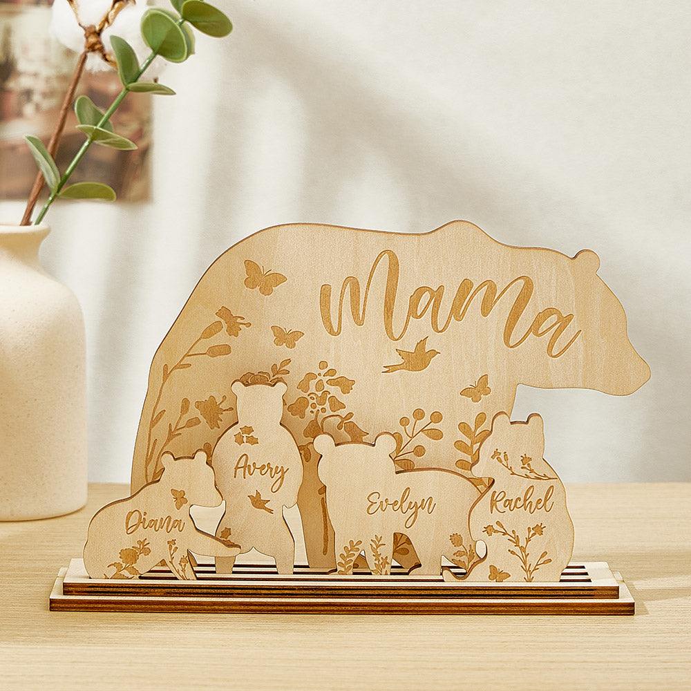 A wooden table decoration featuring a mama bear and four cubs, each customizable with the customer's choice of text, such as "Mom" and the names of her children.