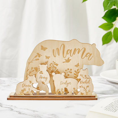 A wooden table decoration featuring a mama bear and four cubs, each customizable with the customer's choice of text, showing the arrangement of the five pieces.