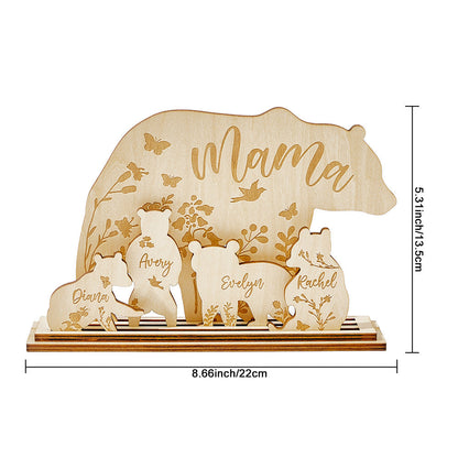 A view of the assembled wooden table decoration featuring a mama bear and four cubs, with an overlay showing the height and width of the piece.