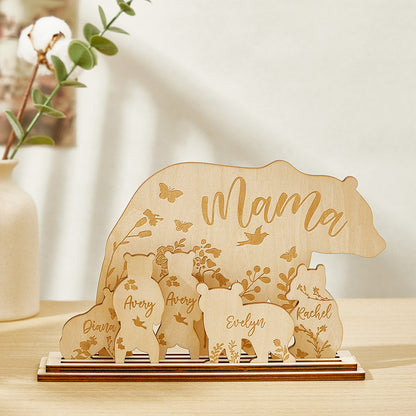 A wooden table decoration featuring a mama bear and five cubs, each customizable with the customer's choice of text, showing the arrangement of the six pieces.