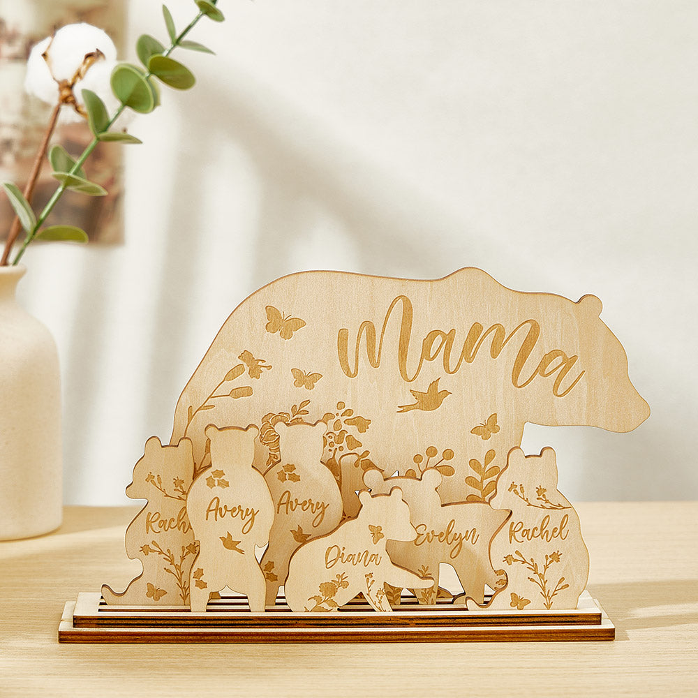 A wooden table decoration featuring a mama bear and six cubs, each customizable with the customer's choice of text, showing the arrangement of the seven pieces.