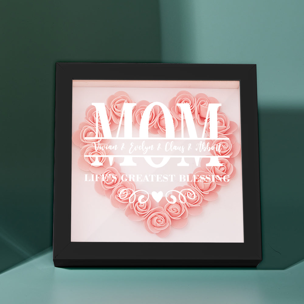 Black-framed artificial flower shadow box with personalized acrylic engraving