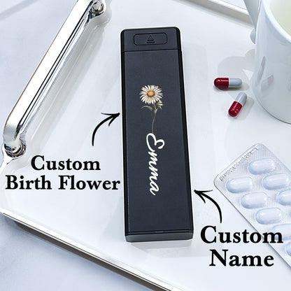 A weekly pill organizer with text highlighting the personalization options, including a custom name and birth flower design on the cover.