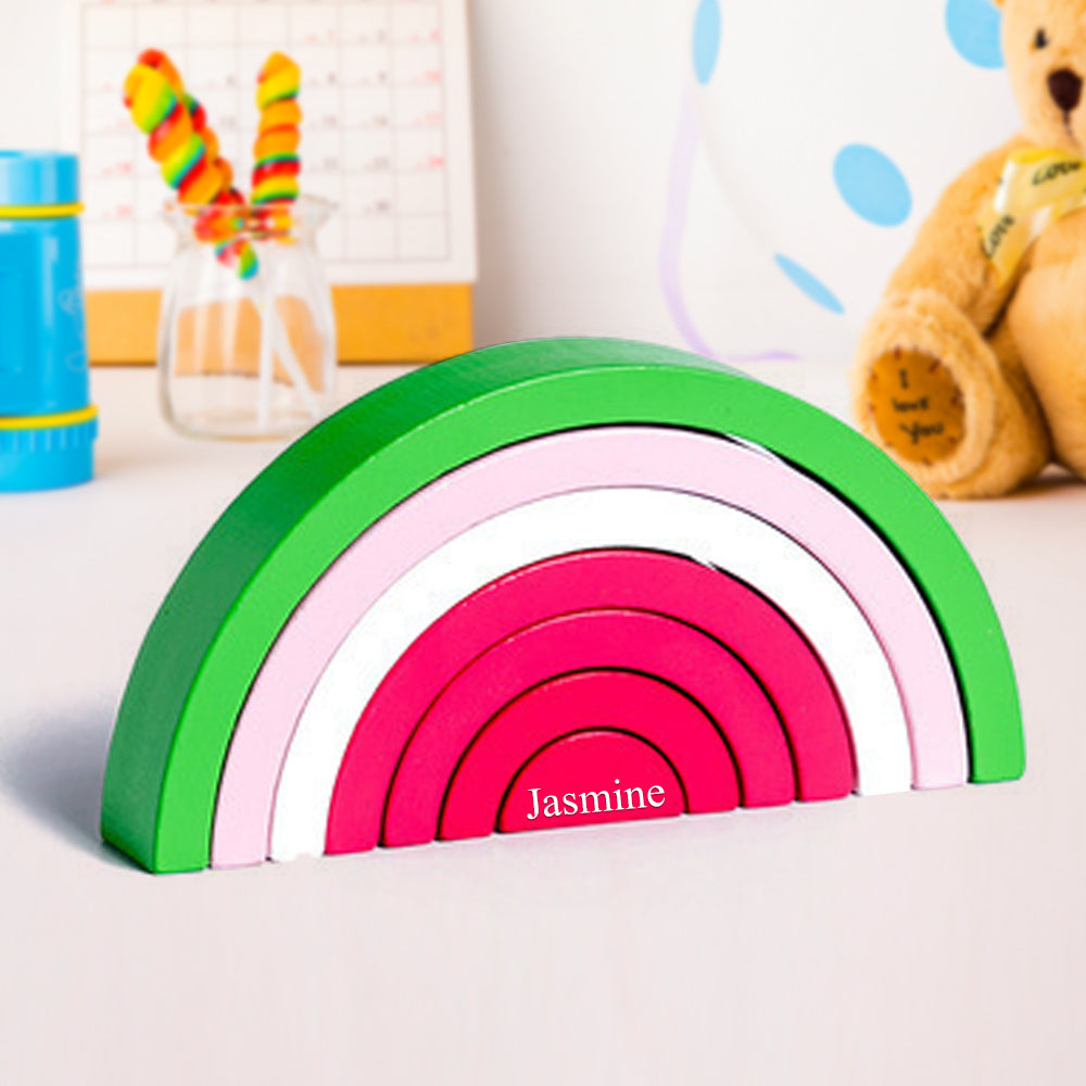 Beautifully crafted rainbow stacking puzzle that encourages sensory development and open-ended play in young children.