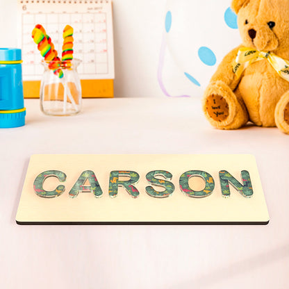 Educational personalized name puzzle for toddlers, handcrafted from wood with acrylic letters in cloud, dinosaur, flower, chrysanthemum, or colorful texture themes.