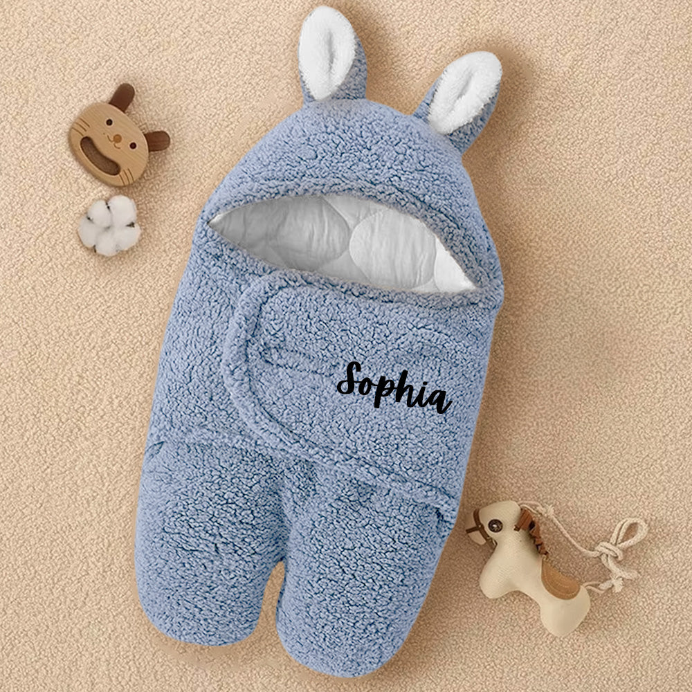 Soft blue footed jacket with custom name, perfect for keeping your baby warm and stylish during outdoor outings, whether a stroll or adventure.