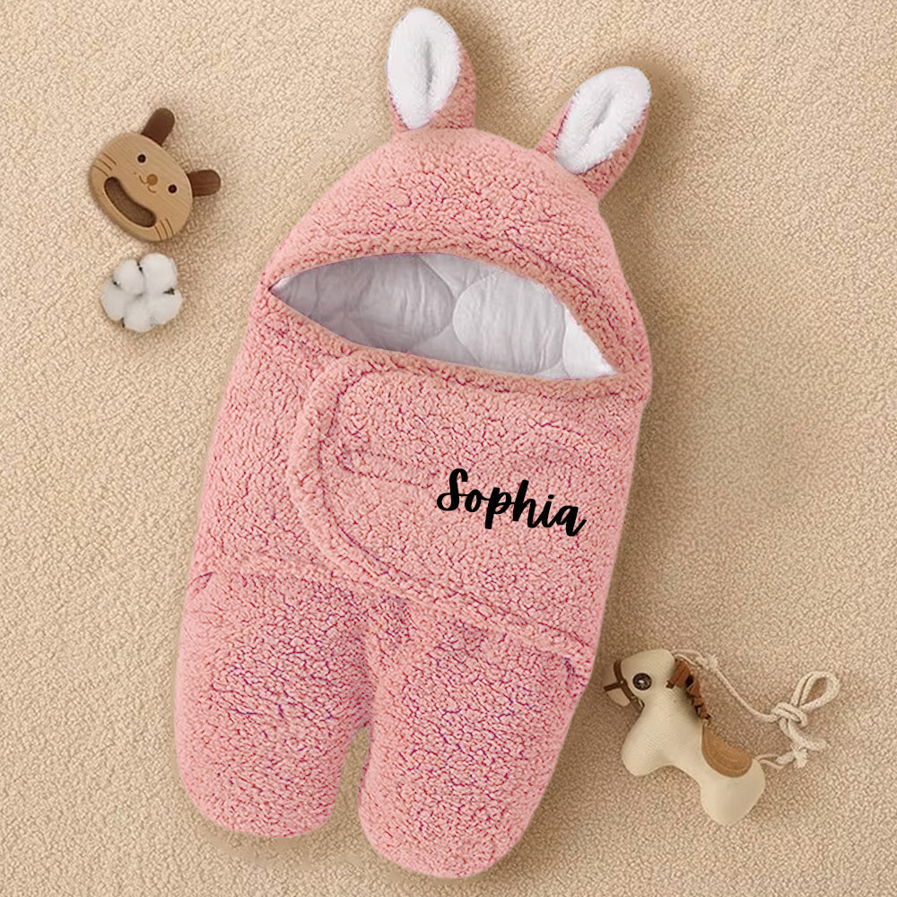 Personalized pink footed jacket for babies with custom name, ideal for keeping your little one warm during outdoor activities or walks.