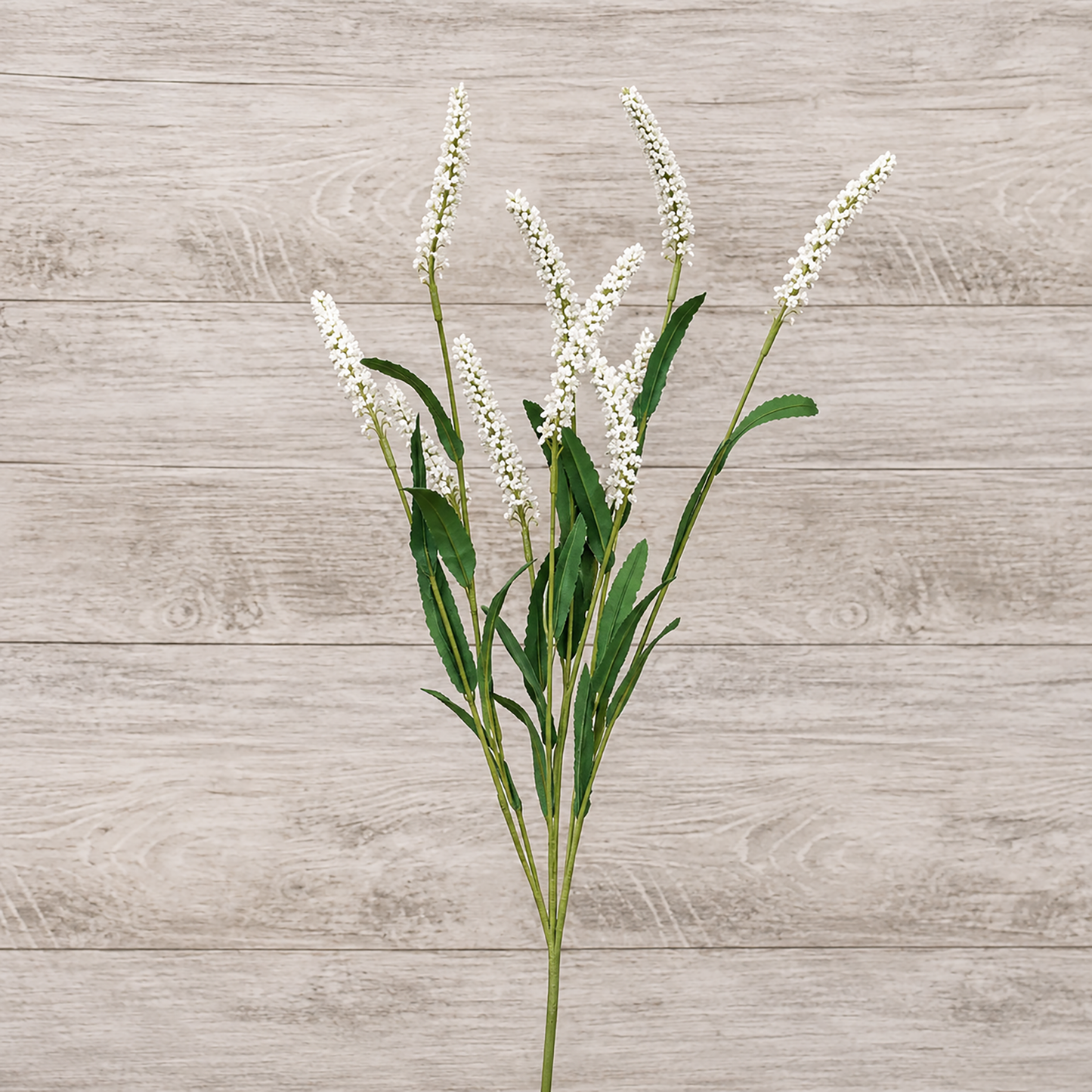 Artificial white floral spray with dark green leaves for rustic farmhouse decorating, primitive home decor, shelf styling, centerpiece arrangements, and country floral displays