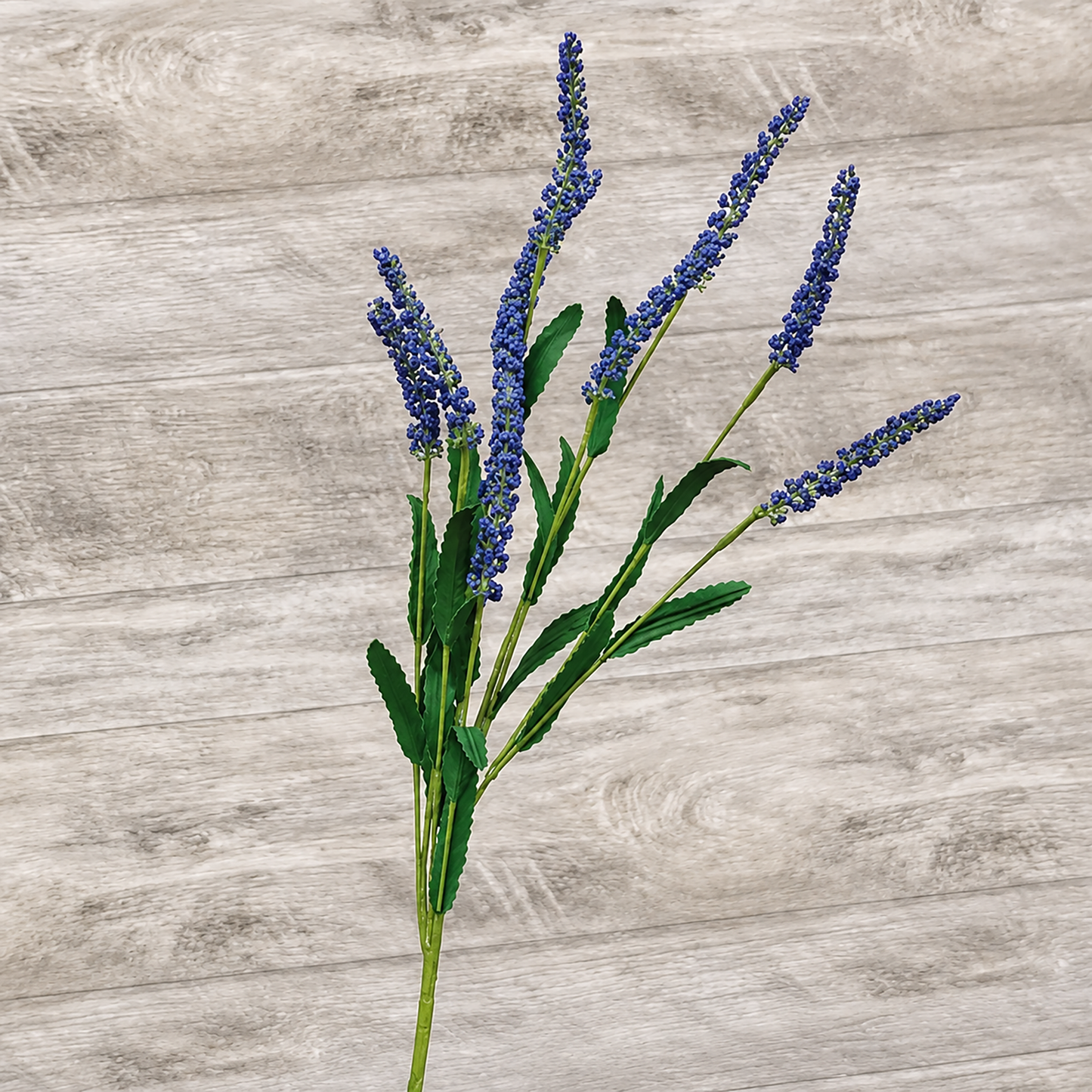 Artificial blue floral spray with dark green leaves for rustic farmhouse decorating, primitive floral arrangements, country shelf styling, centerpiece decor, and everyday home accents