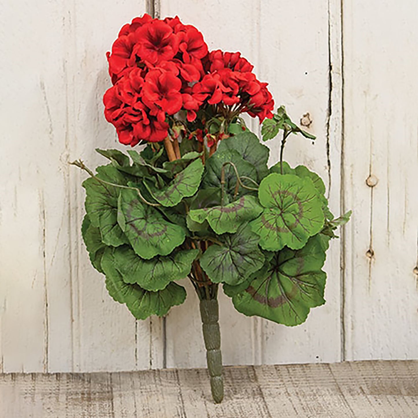 Red faux geranium bush with layered green leaves and rustic farmhouse floral styling