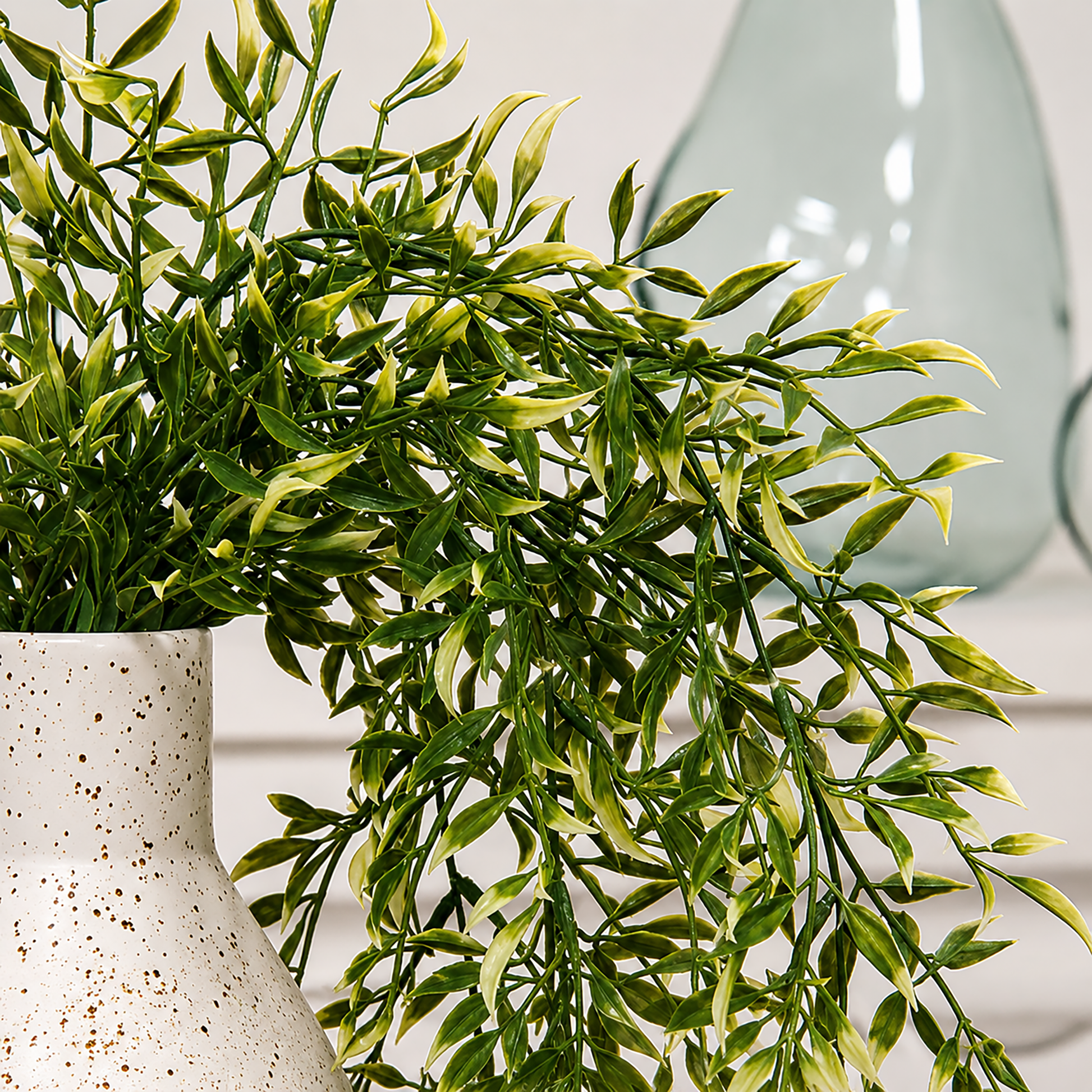 Artificial smilax hanging bush with cream tipped leaves for rustic farmhouse decor, cabinet greenery styling, tabletop arrangements, and primitive home accents