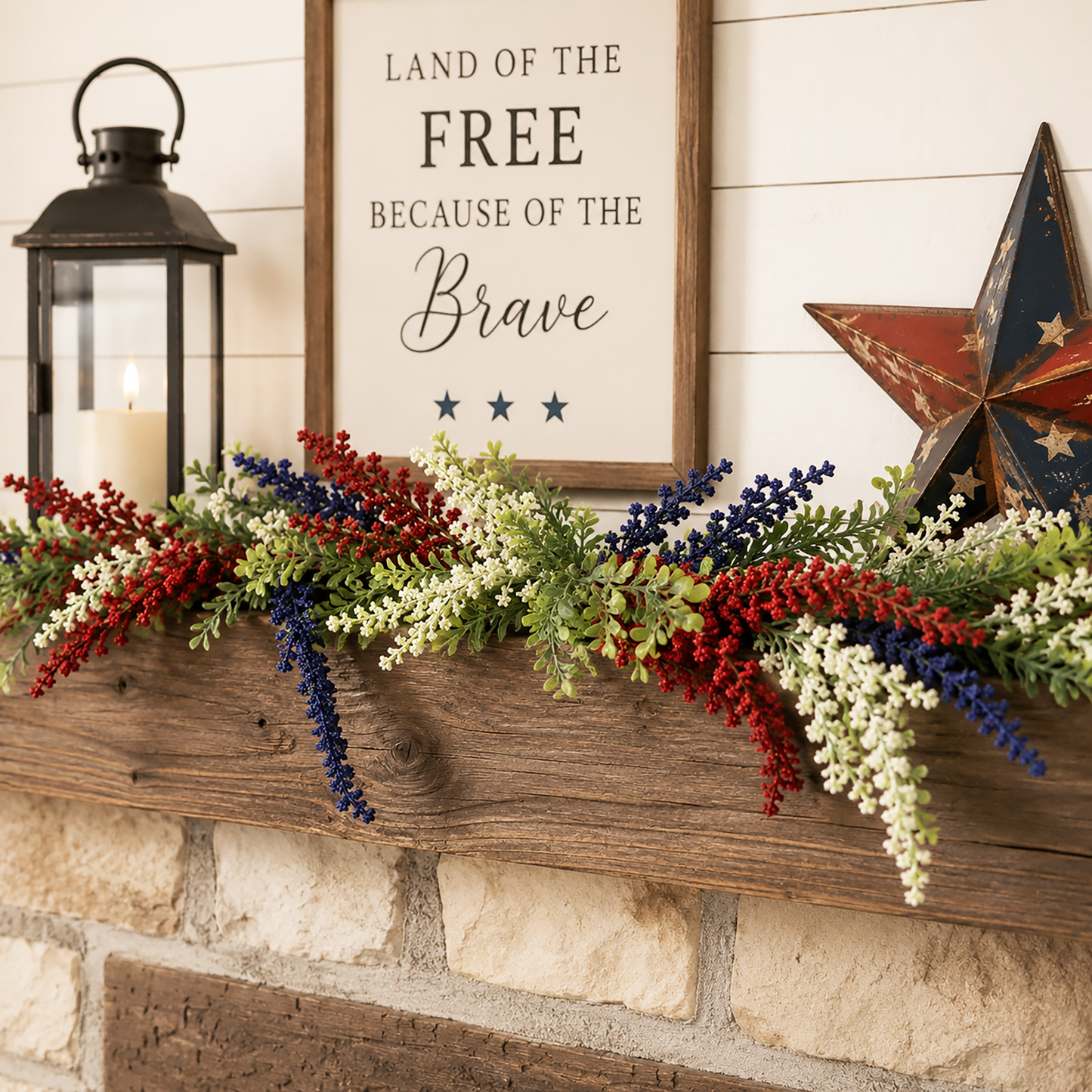 Red white and blue heather garland with dusty boxwood greenery displayed as patriotic farmhouse decor