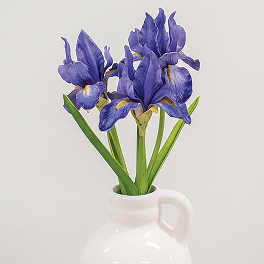 Blue faux iris bouquet with three realistic blooms, green leaves, and raffia bow