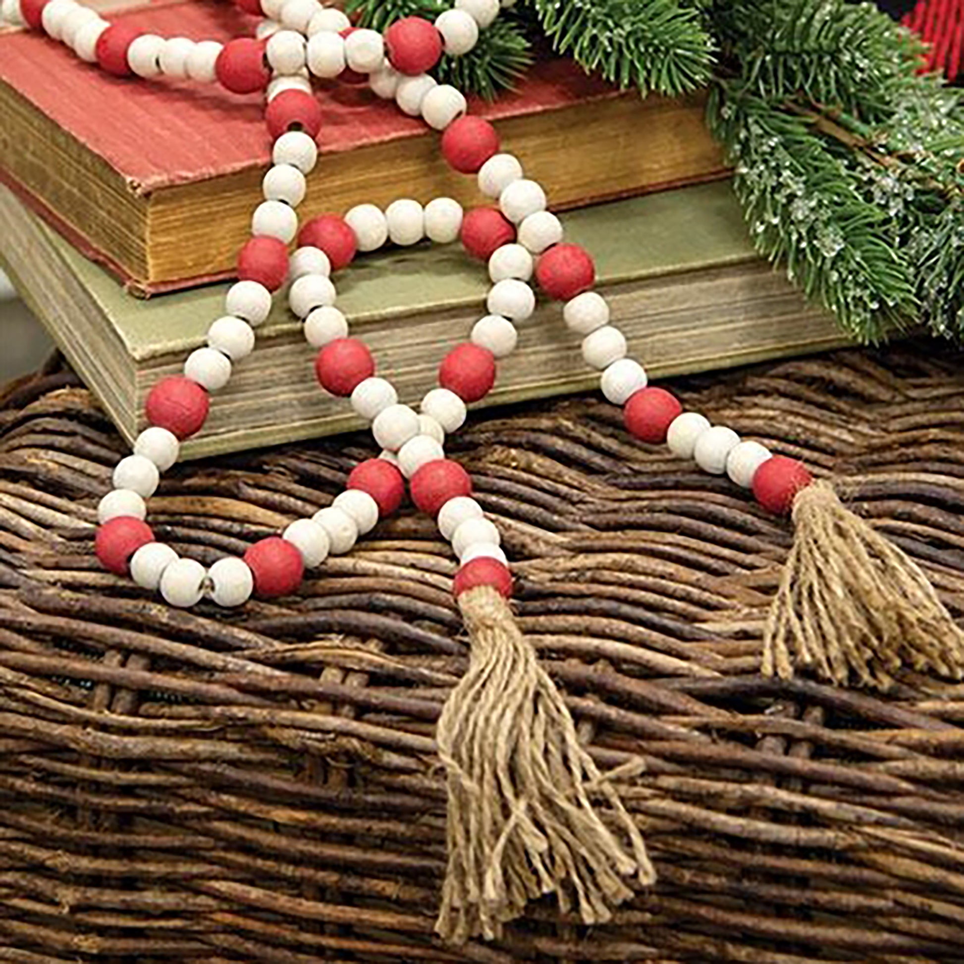 Rustic red and natural wood bead garland with jute tassels styled in country farmhouse décor