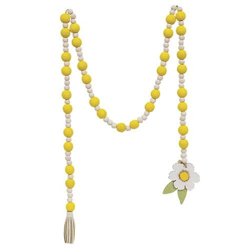 Wooden bead garland in yellow and cream with tassel and flower accent