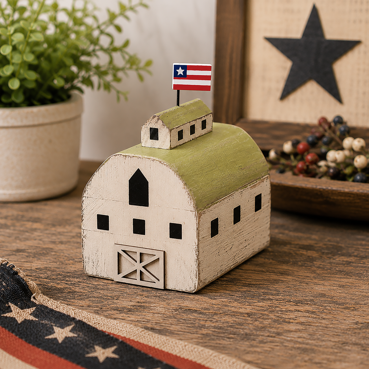 Distressed Americana wooden barn figure with layered green roof, patriotic flag detail, and rustic farmhouse styling