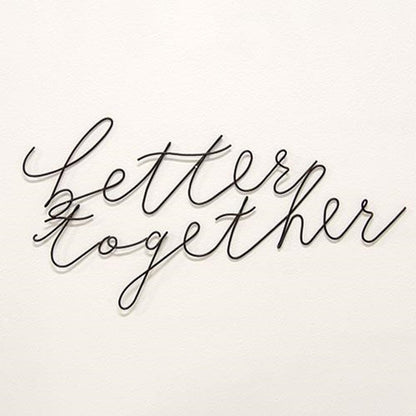 Black wire wall sign reading "better together" in script font on white background