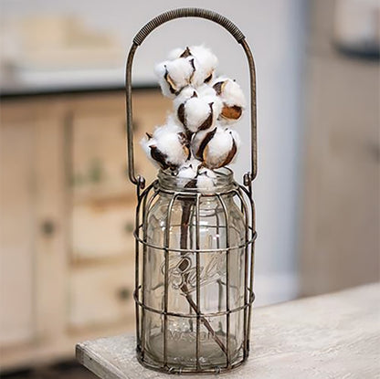 Vintage-style clear glass jar inside distressed metal holder, perfect for country home decor