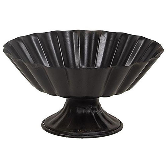 Black metal pedestal urn with scalloped texture and wide bowl for floral displays