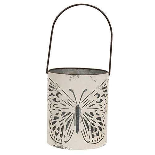 Set of two ivory metal buckets featuring butterfly cutout designs and vintage-style finish