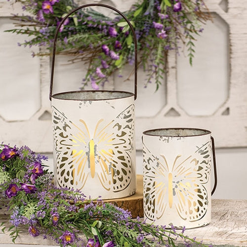 White metal butterfly cutout buckets in two sizes with distressed and rusted detailing