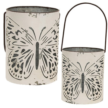 Rustic spring decor buckets with butterfly motifs and aged farmhouse charm