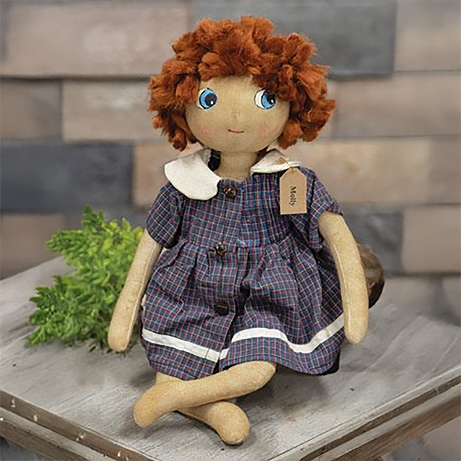 Primitive fabric doll with red yarn hair, vintage-style blue dress, and tea-stained finish, 16-inch display figure with painted face and flexible arms