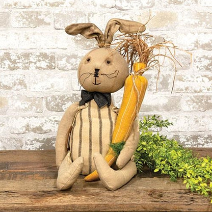 Primitive bunny doll named Alfred with fabric carrot and bow tie