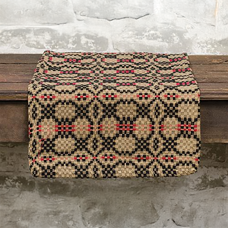 Woven patriot’s knot table runner with black, red, and tan pattern on cotton blend fabric